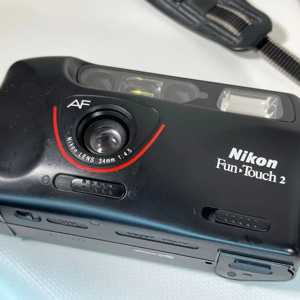 Canon E05 750 35mm camera and Nikon Fun touch 2 35mm camera